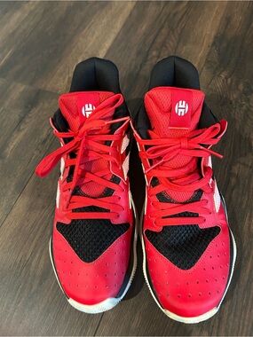 Adidas Harden Stepback basketball sneakers in a vibrant scarlet red colorway.